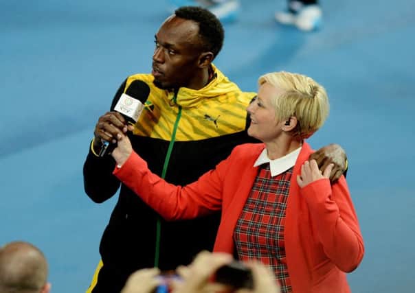 A highlight of compere Alison Walkers year was interviewing sprinter Usain Bolt. Picture: Contributed