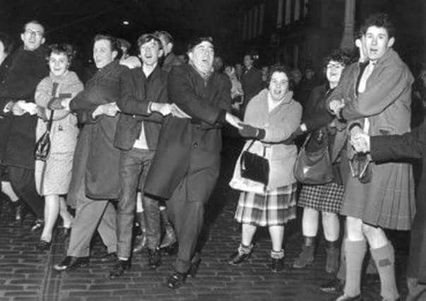 Auld Lang Syne outside the Tron in 1964. Picture: TSPL