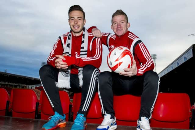 Andrew Considine, left, and Jonny Hayes have added to the feelgood factor at Aberdeen. Picture: SNS
