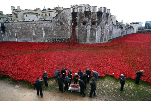 The poppies at the Tower, which led to their creators Paul Cummins and Tom Piper receiving MBEs. Picture: Getty