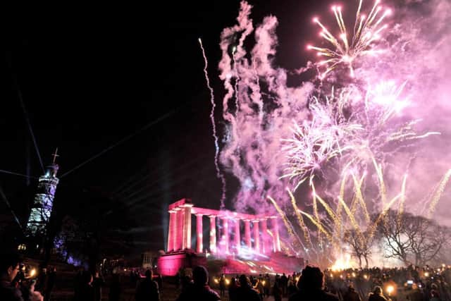 Fireworks go off over Calton Hill. Picture: Ian Rutherford