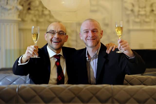 Malcolm Brown and Joe Schofield raise a glass ahead of their Hogmanay wedding.  Picture: John Devlin