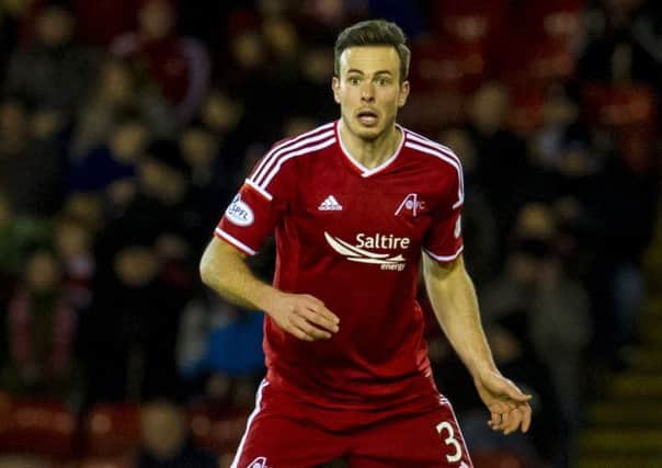 Andrew Considine has signed a new contract which keeps him at Aberdeen until 2017. Picture: SNS