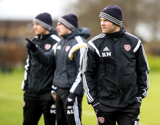 Hearts head coach Robbie Neilson supervises training at Riccarton yesterday. Picture: SNS