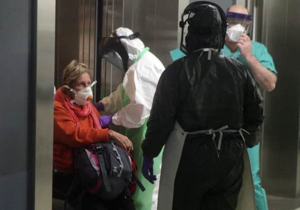Woman at Aberdeen Royal Infirmary for Ebola tests. Picture: SWNS