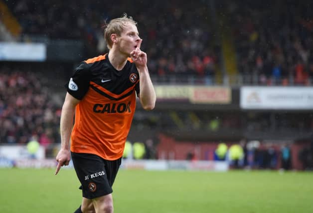 Gary Mackay-Steven celebrates his goal for Dundee Utd. Picture: SNS