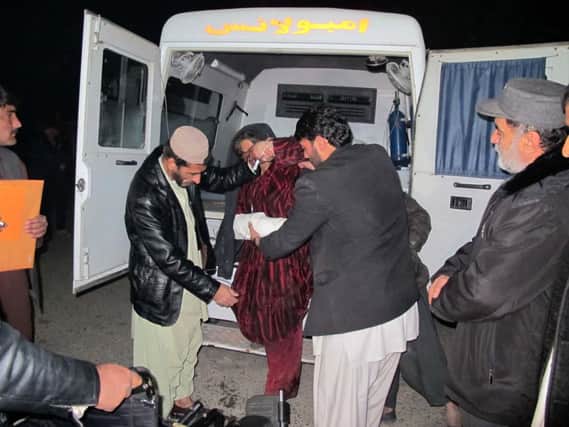 A wounded woman is taken to hospital after the attack on the wedding party in Helmand province. Picture: Getty