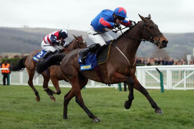 Splash of Ginge, ridden by Jamie Bargary, on the way to victory in the BetBright Best for Festival Betting Handicap Chase. Picture: PA