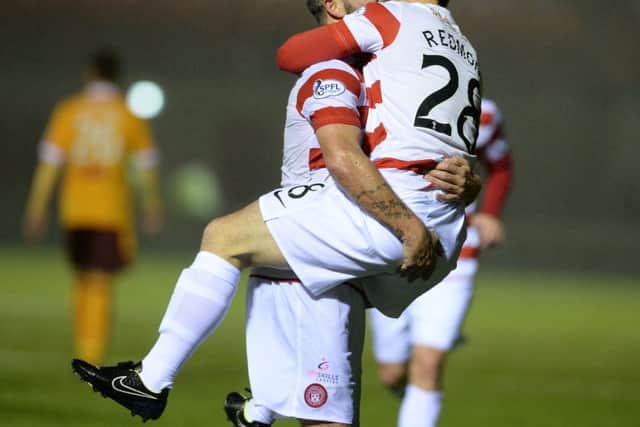 Hamilton's Danny Redmond celebrates with team-mate Dougie Imrie having scored his side's fifth goal. Picture: SNS