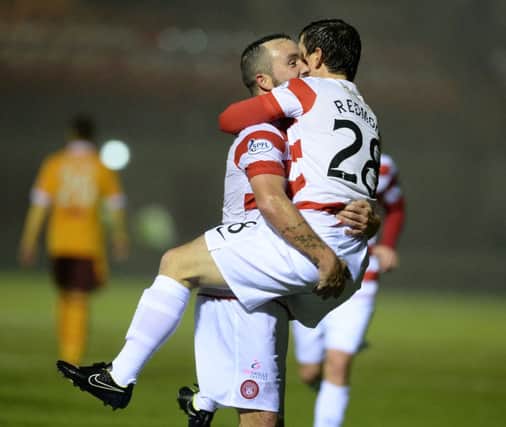 Hamilton's Danny Redmond celebrates with team-mate Dougie Imrie having scored his side's fifth goal. Picture: SNS
