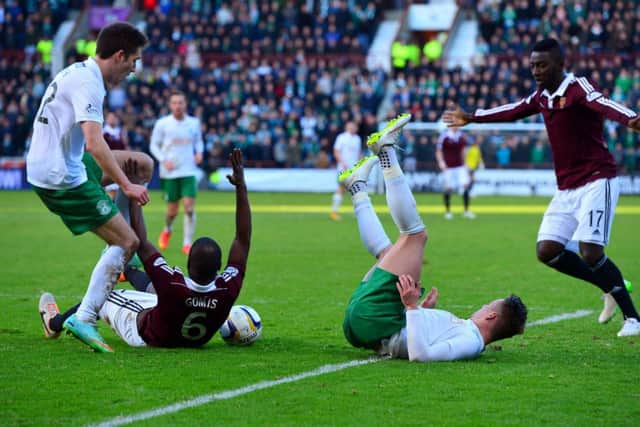 Morgaro Gomis appeals for a penalty late in the second half during the hotly-contested derby at Tynecastle. Picture: Getty