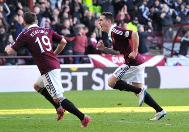 Winger Jamie Walker turns away to celebrate after his blistering shot provided Hearts with the equalising goal. Picture: Ian Rutherford