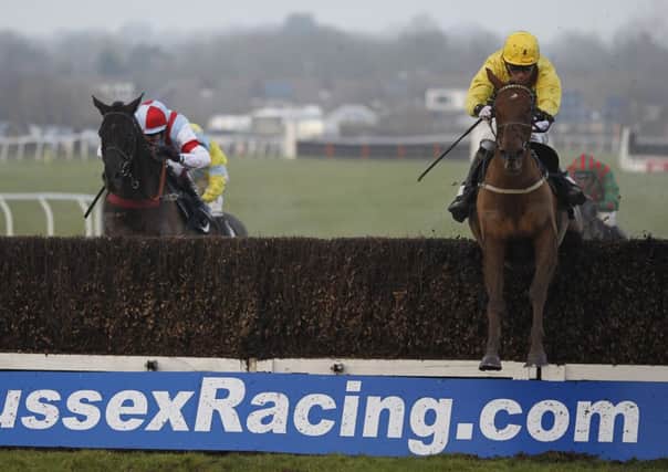 At Plumpton yesterday, Tom Cannon rode 11-1 shot Itoldyou (right) clear of the last to win the At The Races Sussex National. Picture: Getty