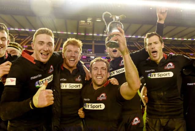 Mike Coman celebrates with the trophy and team-mates, from left, Dougie Fife, Roddy Grant and Tim Visser. Picture: SNS/SRU