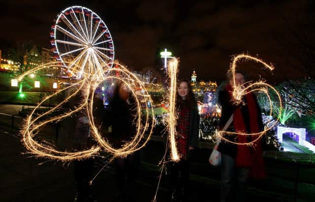 Revellers create 2015 with sparklers in Princes Street Gardens. Picture: SWNS