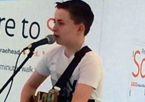 Schoolboy busker raises £13 a minute for George Square tragedy victims. Picture: Contributed