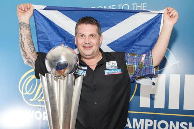 Musselburgh-born Gary Anderson celebrates becoming only the third Scot to become a world darts champion. Picture: Steve Welsh