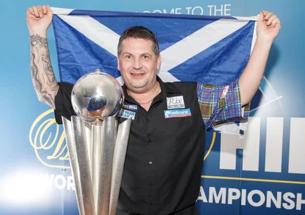 Musselburgh-born Gary Anderson celebrates becoming only the third Scot to become a world darts champion. Picture: Steve Welsh