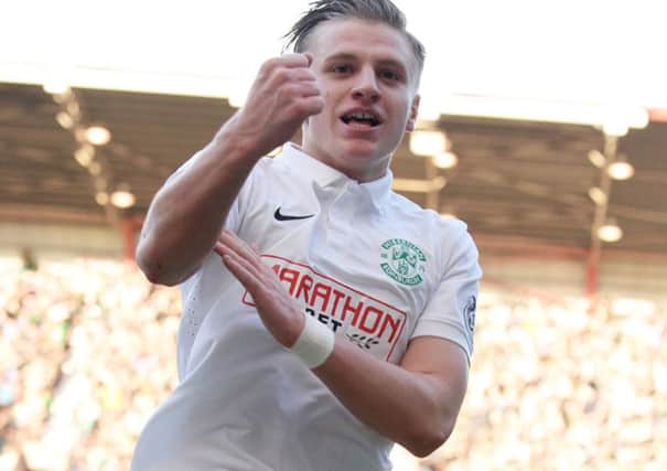 Jason Cummings after he put Hibs ahead at Tynecastle. Picture: SNS