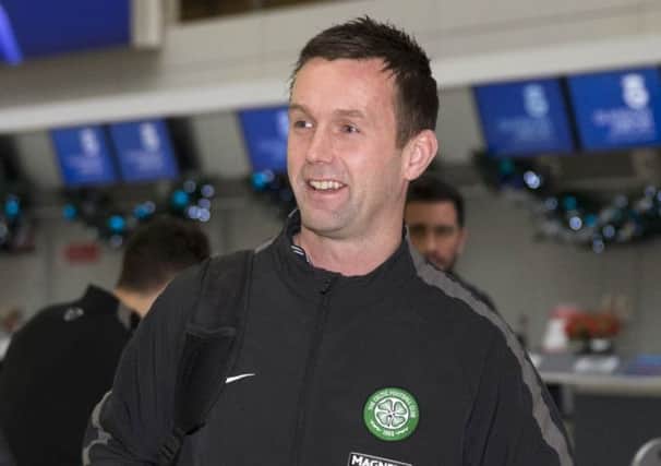 Ronny Deila at Glasgow airport en route to Celtics winter training camp in Gran Canaria. Picture: PA