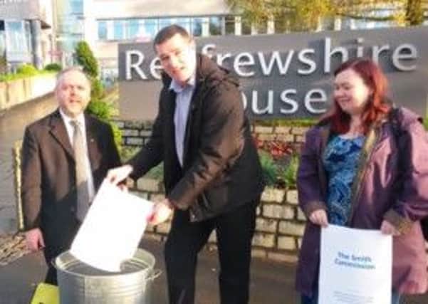 Brian Lawson, Will Mylet and Mags MacLaren pictured burning the Smith Commission report. Picture: YouTube