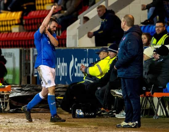 James McFadden makes his gesture after being sent off by referee Andrew Dallas and is consoled by Tommy Wright. Pictures: SNS