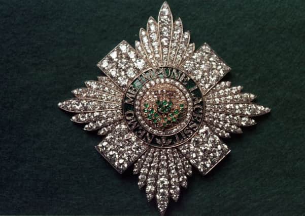 The motto can be seen here used on this broach for the Order of the Thistle. Picture: TSPL