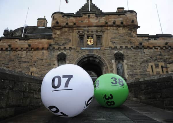 Lotto balls outside Edinburgh Castle. A married couple has scooped more than 4 million pounds in a rollover draw. Picture: TSPL