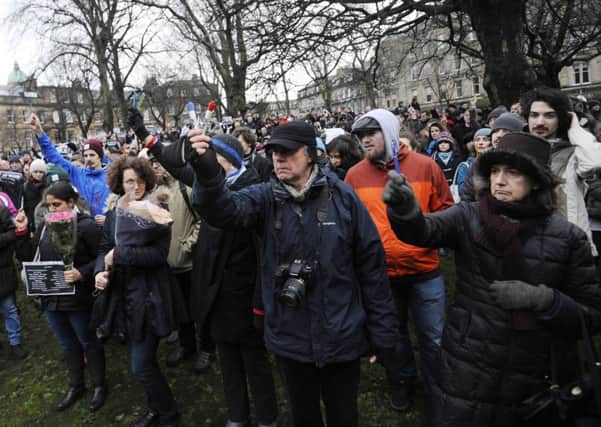 People gather outside the French Institute in Scotland in Edinburgh. Picture: Greg Macvean