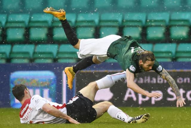 Martin Boyle is felled by David McCracken. The on-loan Dundee striker missed a chance to make it 4-1. Picture: Greg Macvean