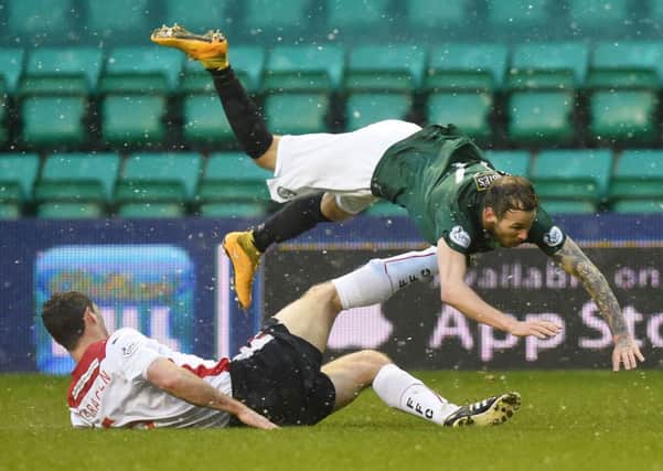 Martin Boyle is felled by David McCracken. The on-loan Dundee striker missed a chance to make it 4-1. Picture: Greg Macvean