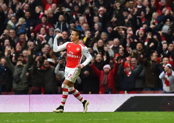 Arsenal's Chilean striker Alexis Sanchez celebrates after scoring their second goal. Picture: Getty