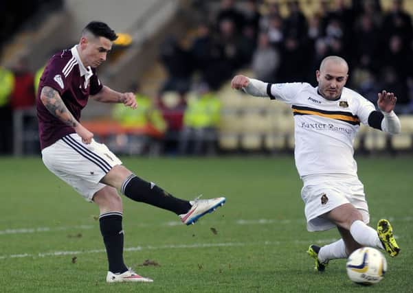 Jamie Walker scores his and Hearts' second goal. Picture: John Devlin