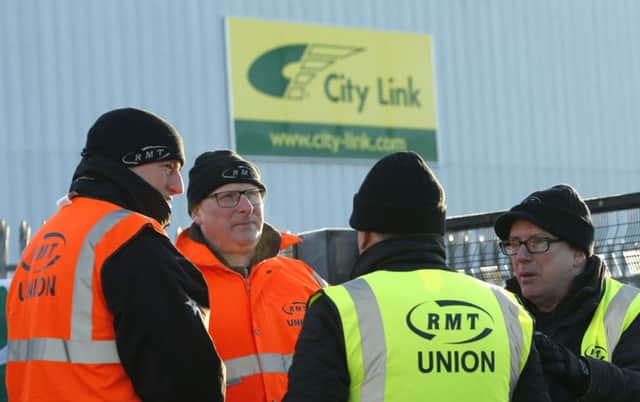 City Link staff at a picket line outside the firm's base in Motherwell. Picture: PA