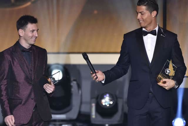 Lionel Messi with Ronaldo. Picture: Getty