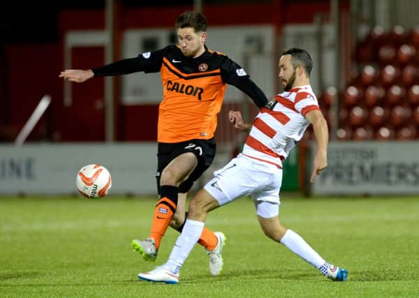 Hamilton's Dougie Imrie challenges Dundee United's Calum Butcher for the ball. Picture: SNS