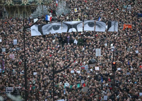 Demonstrators make their way along Boulevard Voltaire in a unity rally in Paris following the recent terrorist attacks. Picture: Getty