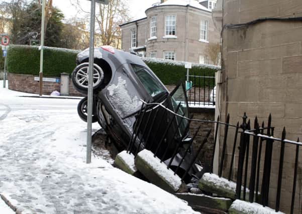 The snow caused crashes up and down the country including this one in Dundee. Picture: David Martin