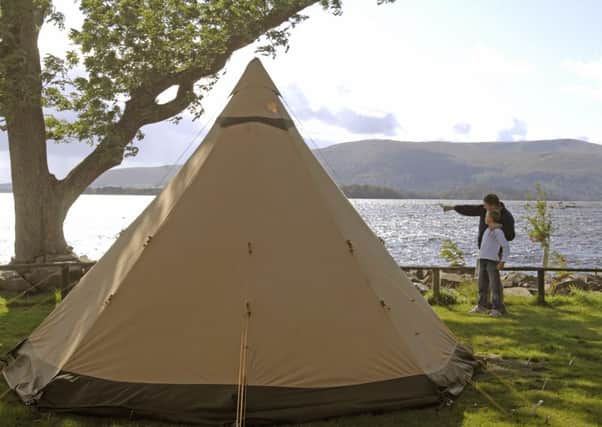 Two campers enjoy the Milarrochy Bay Camping and Caravanning site. Picture: Dan Phillips