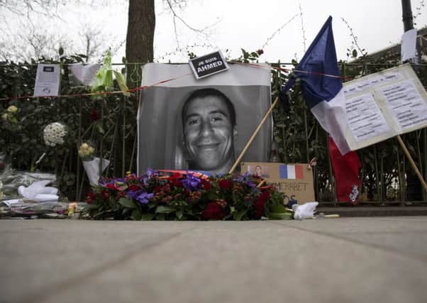 A tribute to murdered police officer Ahmed Merabet ahead of his funeral in Bobigny. Picture: Getty