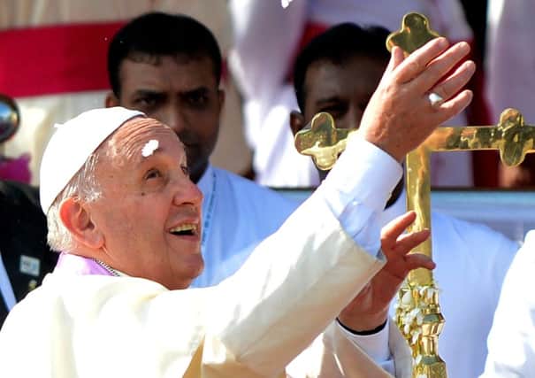 Pope Francis releases a dove as a symbol of peace at the Madhu church in north-west Sri Lanka. Picture: Getty