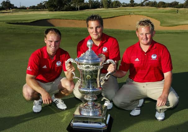 Gavin Dear, centre, with Wallace Booth and Callum Macaulay and the Eisenhower Trophy. Picture: Getty
