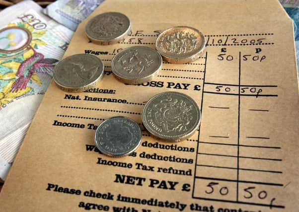 MSPs have been told that a failure to devolve the minimum wage in Scotland was a 'clear miss' for low paid workers. Picture: Getty