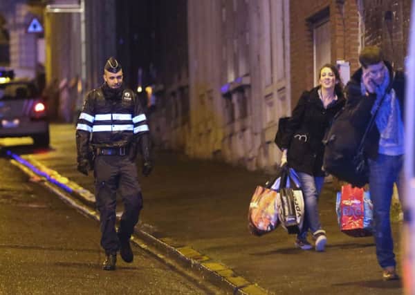Police set a large security perimeter around a street in the city centre of Verviers. Picture: AFP/Getty