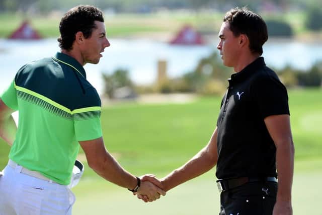 Rory McIlroy of Northern Ireland and Rickie Fowler of the USA shake hands after their opening round. Picture: Getty