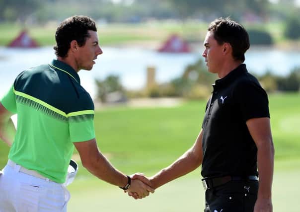 Rory McIlroy of Northern Ireland and Rickie Fowler of the USA shake hands after their opening round. Picture: Getty