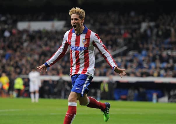 Atletico Madrids Fernando Torres celebrates the quickfire first of last nights double. Picture: Getty