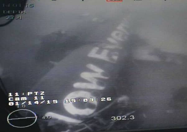Bad weather has delayed the search for bodies around the fuselage of the AirAsia plane (pictured). Picture: Getty