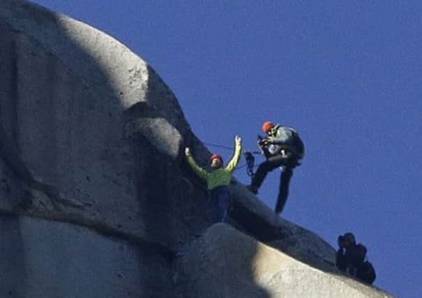Caldwell, left, and Jorgeson toast their ascent of the Dawn Wall. Picture: AP