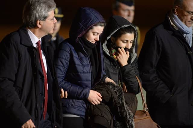 Greta Ramelli, second left and Vanessa Marzullo are welcomed in Rome by Italys foreign minister Paolo Gentiloni, left. Picture: Getty